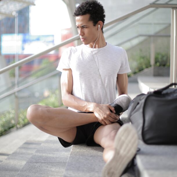 Person stretching listening to music