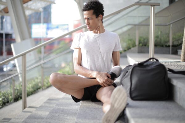 Person stretching listening to music